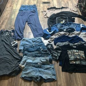 11 shirts, 3 Pants*1 sweats*, 5 shorts and 2 dresses